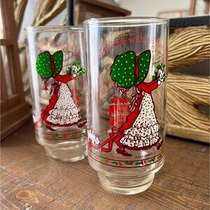 Two Holly Hobbie Christmas Collectible Coca Cola Glasses